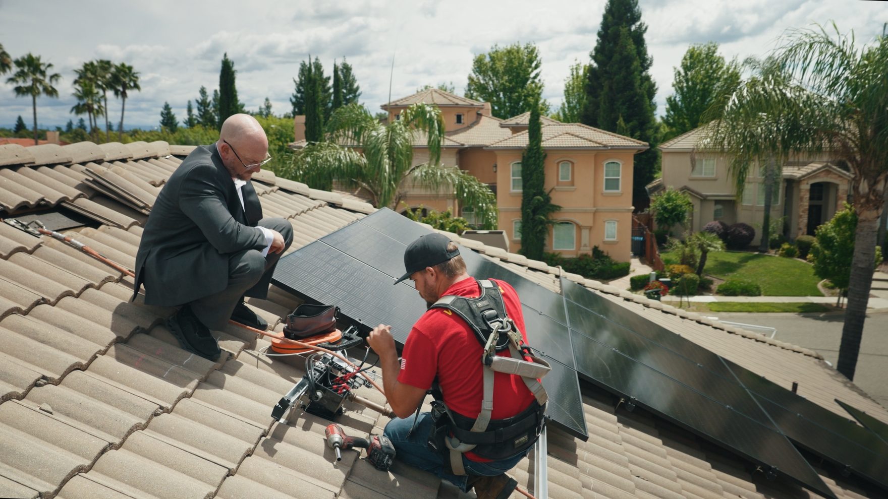 Westhaven Power founder and an installer fitting solar panels on a Northern California home